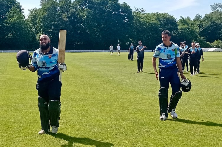 Mujahid Ilyas raises his bat after scoring a ton against Cardiff