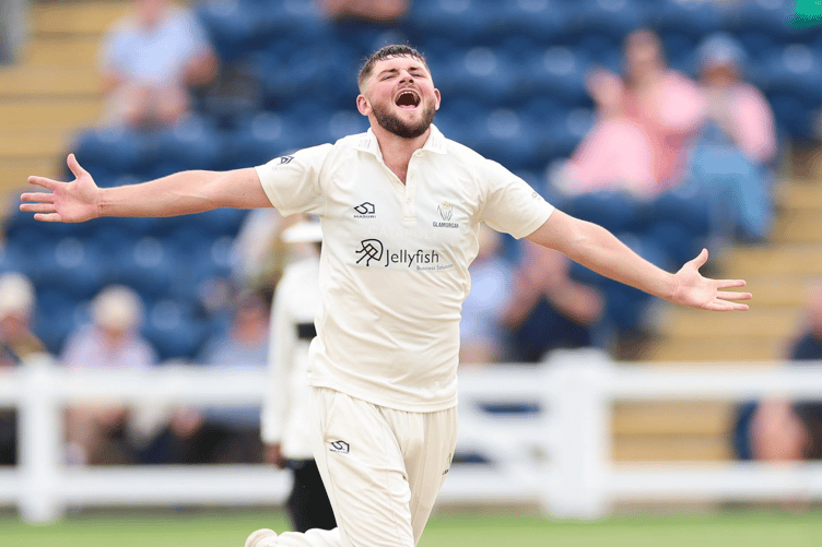 Tom Norton celebrates his maiden Championship five-wicket haul