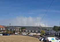 Firefighters make good progress on wildfire which is no longer a 'major incident'