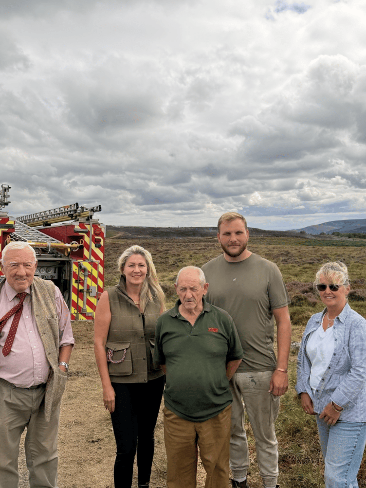 Laura Anne Jones talks to farmers about wildfires in Wales.