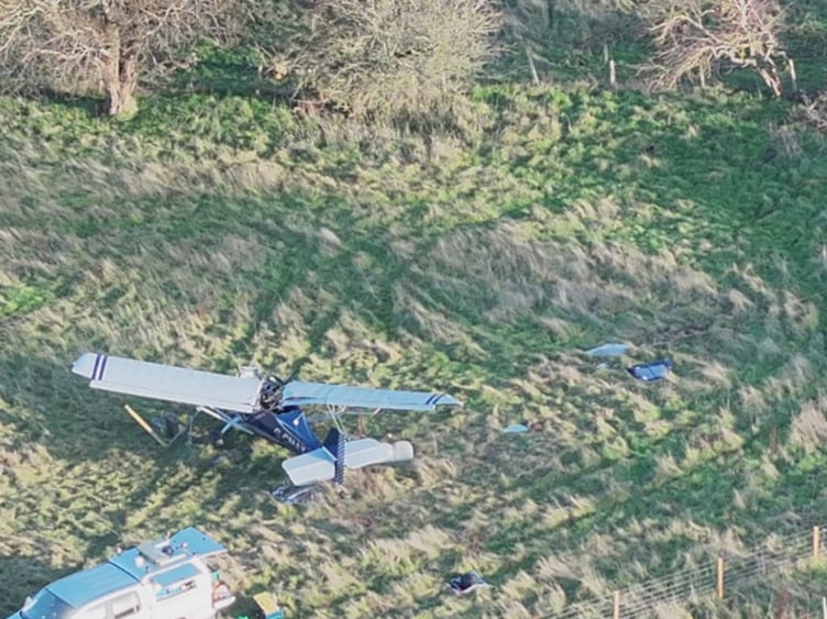 The plane crashed in a field beside the airfield