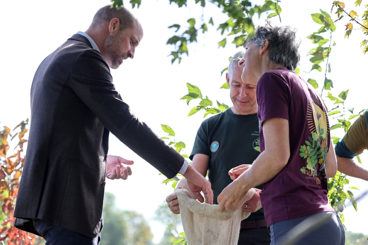 The Prince of Wales joins volunteers participating in a seed collection activity during a visit to White Castle Farm in Abergavenny, Monmouthshire, to meet representatives from Stump Up For Trees, a community-based environmental charity working across South Wales to restore native woodland and recognise its powerful potential to support sustainable solutions to flooding risk. Picture date: Thursday October 1, 2026. PA Photo. Photo credit should read: Chris Jackson/PA Wire