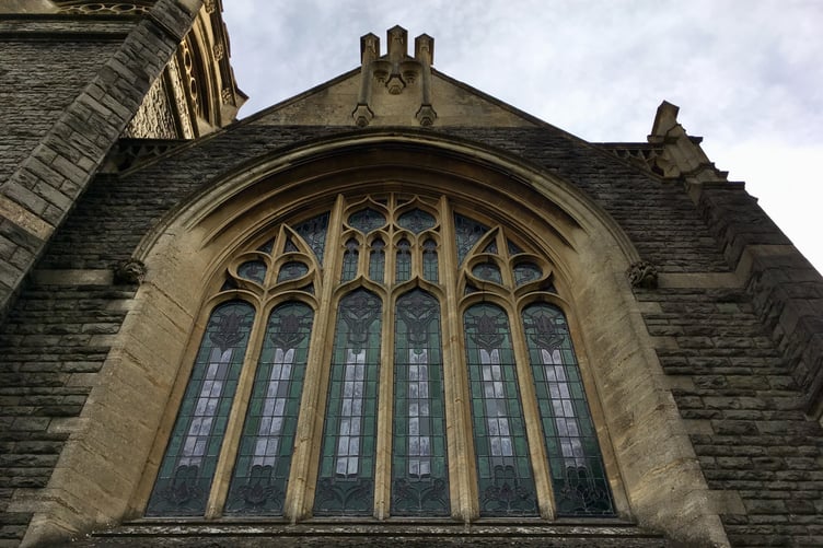 The stained glass window of a church