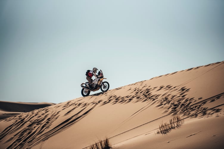 A girl on a motorbike .